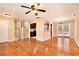 Open-concept living area with hardwood floors leading to the kitchen and dining area at 1736 Inas Way, Tucker, GA 30084