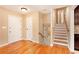Living room features hardwood floors, white walls, and stairs to the second floor at 1736 Inas Way, Tucker, GA 30084