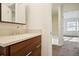 Bathroom with modern vanity, quartz countertop, and access to bedroom at 2232 Dunseath Nw Ave # 303, Atlanta, GA 30318