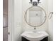 Stylish powder room features a modern sink, round mirror, and updated fixtures at 2232 Dunseath Nw Ave # 303, Atlanta, GA 30318