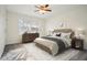 Bright bedroom with a ceiling fan, carpeted floors, and large window for natural light at 2232 Dunseath Nw Ave # 303, Atlanta, GA 30318