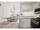 Beautifully updated kitchen featuring stainless steel appliances and granite countertops at 2232 Dunseath Nw Ave # 303, Atlanta, GA 30318