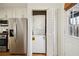 Efficient kitchen includes a stackable washer and dryer for convenient laundry access at 2232 Dunseath Nw Ave # 303, Atlanta, GA 30318