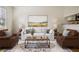 Comfortable living room with a large window, hardwood floors, and bright natural light at 2232 Dunseath Nw Ave # 303, Atlanta, GA 30318