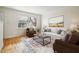 Inviting living room with hardwood floors and an open view to the updated kitchen at 2232 Dunseath Nw Ave # 303, Atlanta, GA 30318