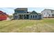 Expansive backyard view of the home featuring a covered patio, and large windows for natural light at 4041 Andover Cir, Mcdonough, GA 30252