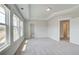 Well-lit primary bedroom with an en-suite bathroom, walk-in closet, and large windows at 4041 Andover Cir, Mcdonough, GA 30252