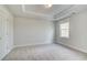 Bright bedroom with plush carpeting, tray ceiling and a window that brings in natural light at 4041 Andover Cir, Mcdonough, GA 30252