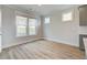 Bright breakfast nook with large windows, hardwood floors, and neutral paint at 4041 Andover Cir, Mcdonough, GA 30252