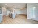 A spacious kitchen features gray cabinets, stainless appliances, and a large island overlooking the living room at 4041 Andover Cir, Mcdonough, GA 30252