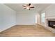 Open living room with hardwood floors, fireplace, and neutral paint at 4041 Andover Cir, Mcdonough, GA 30252