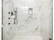 Luxurious bathroom features a stunning marble tile shower with modern fixtures for a spa-like experience at 580 Hutchens Se Rd, Atlanta, GA 30354