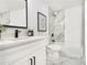 Chic bathroom with marble accents, featuring a shower-tub combo and modern decor for a spa-like retreat at 580 Hutchens Se Rd, Atlanta, GA 30354
