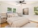 Serene bedroom with neutral tones, complemented by natural light, and ceiling fan, offering a relaxing atmosphere at 580 Hutchens Se Rd, Atlanta, GA 30354