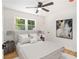 Bright bedroom with natural light, ceiling fan, and cozy decor, ideal for a comfortable and relaxing retreat at 580 Hutchens Se Rd, Atlanta, GA 30354