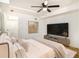 Bright and spacious bedroom with a large TV, ceiling fan, and neutral color scheme at 580 Hutchens Se Rd, Atlanta, GA 30354