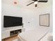 Contemporary bedroom with TV, ceiling fan, and modern decor, perfect for relaxation and entertainment at 580 Hutchens Se Rd, Atlanta, GA 30354