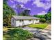 Charming renovated one-story home featuring a well-maintained lawn and ample parking space at 580 Hutchens Se Rd, Atlanta, GA 30354