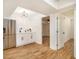 Modern kitchenette with stainless steel refrigerator, white cabinets, and stylish lighting at 580 Hutchens Se Rd, Atlanta, GA 30354
