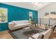 Bright living room with hardwood floors, neutral furniture, accent wall, and railing at 580 Hutchens Se Rd, Atlanta, GA 30354