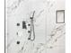 Modern shower with marble tile and black fixtures at 580 Hutchens Se Rd, Atlanta, GA 30354