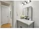 Bright bathroom with a gray vanity, marble countertop, and modern fixtures at 6852 Old Beulah Rd, Lithia Springs, GA 30122