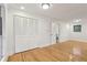 This bedroom features hardwood floors, a closet, neutral paint and natural light at 6852 Old Beulah Rd, Lithia Springs, GA 30122