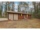 Attractive home with a brick facade, wood siding, and a neatly landscaped front entrance at 6852 Old Beulah Rd, Lithia Springs, GA 30122