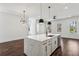 Kitchen featuring a white island, stainless steel appliances, and modern pendant lighting at 2200 Carlton Ct # 6, Atlanta, GA 30318