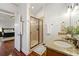 Bathroom with dual sinks, granite countertop, and a glass-enclosed shower at 2580 Defoors Ferry Nw Rd, Atlanta, GA 30318