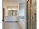 Elegant bathroom featuring a double vanity, soaking tub, and glass-enclosed shower for a spa-like experience at 4045 Andover Cir, Mcdonough, GA 30252