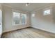 Bedroom featuring hardwood floors, neutral paint, and windows offering natural light at 4045 Andover Cir, Mcdonough, GA 30252