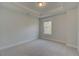 Bedroom featuring carpet, tray ceiling, natural light, and neutral paint at 4045 Andover Cir, Mcdonough, GA 30252