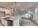 Modern kitchen featuring white cabinets, an island, stainless steel appliances, and hardwood floors at 4045 Andover Cir, Mcdonough, GA 30252