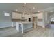 Beautiful kitchen with white cabinets, center island, stainless steel appliances, and hardwood floors at 4045 Andover Cir, Mcdonough, GA 30252