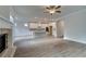 Open-concept floor plan featuring hardwood floors, a fireplace, and a kitchen island perfect for modern living at 4045 Andover Cir, Mcdonough, GA 30252