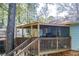 Outdoor covered deck offering a relaxing space for entertaining and enjoying the outdoors at 410 Killian Hill Sw Rd, Lilburn, GA 30047