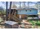 Back exterior view featuring a deck, stairs, trailer, and storage shed at 410 Killian Hill Sw Rd, Lilburn, GA 30047