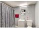 Cozy bathroom with a shower-tub combination, single sink vanity, and a neutral color scheme at 410 Killian Hill Sw Rd, Lilburn, GA 30047