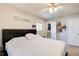 Neutral bedroom with a large bed, ceiling fan and natural light at 410 Killian Hill Sw Rd, Lilburn, GA 30047