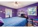 Purple bedroom with a window view and simple decor. Ready for personalization at 410 Killian Hill Sw Rd, Lilburn, GA 30047