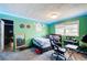 Bedroom view featuring green walls, window, ceiling light, and a bed with an office area setup at 410 Killian Hill Sw Rd, Lilburn, GA 30047