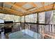 Covered deck with grill and table at 410 Killian Hill Sw Rd, Lilburn, GA 30047