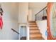 View of the home's entryway featuring hardwood stairs, access to basement, and classic trim at 410 Killian Hill Sw Rd, Lilburn, GA 30047