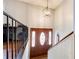 Inviting foyer with a chandelier and decorative front door at 410 Killian Hill Sw Rd, Lilburn, GA 30047