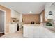 Spacious kitchen with white cabinets and an eat-in area at 410 Killian Hill Sw Rd, Lilburn, GA 30047