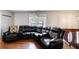 Cozy living room with plush seating and hardwood floors at 410 Killian Hill Sw Rd, Lilburn, GA 30047