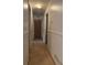 The hallway has neutral walls and carpet, and doors leading to other rooms at 4227 Cheryl Ann Court Ct, Stone Mountain, GA 30083