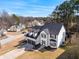 Aerial view of the property showcasing the home, driveway, well manicured lawn and surrounding neighborhood at 6107 Waterton Dr, Lithonia, GA 30058