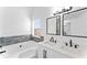 Bathroom with dual sinks and plenty of natural light at 6107 Waterton Dr, Lithonia, GA 30058